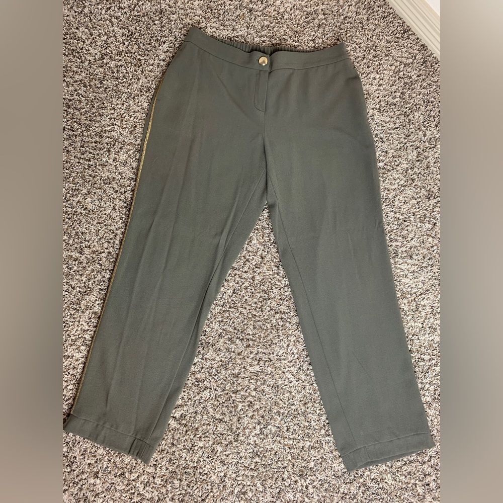 Caroline Biss: Green pants with a gold stripe on the side. comfortable.